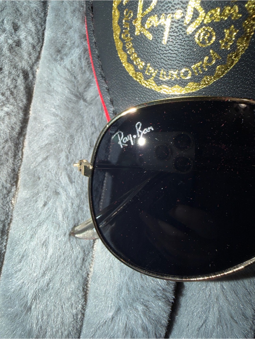 the Ray-Ban RB3025 Aviator Classic model in a gold frame with dark lenses.